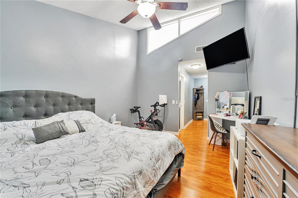 701 St Michael Lane Altamonte Springs, FL 32714 - Photo 7 of 19 a bedroom with a bed and flat screen tv