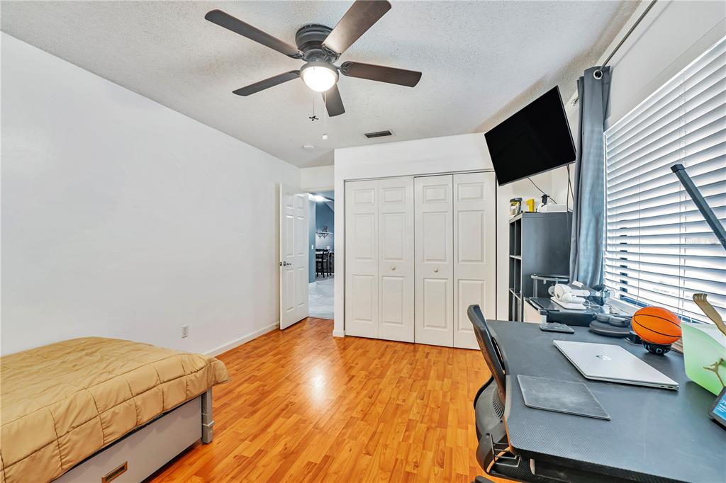 701 St Michael Lane Altamonte Springs, FL 32714 - Photo 9 of 19 a bedroom with a bed and a flat screen tv