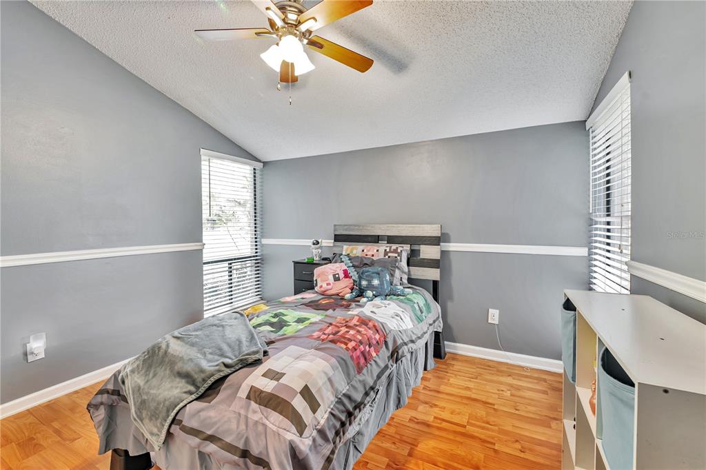 701 St Michael Lane Altamonte Springs, FL 32714 - Photo 10 of 19 a bedroom with a bed and window