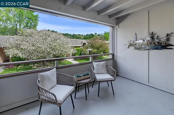 a view of a two chair in the balcony