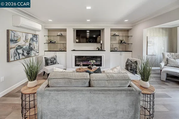 a living room with furniture and a fireplace