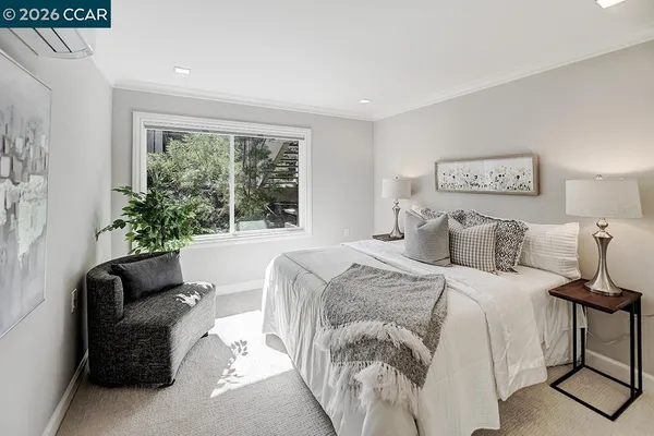 a bedroom with a bed and a couch