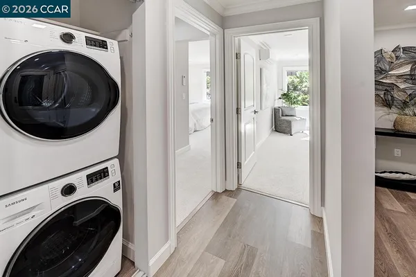 a view of a hallway with washer and dryer