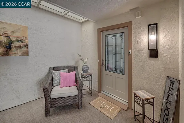 a bedroom with furniture and a window