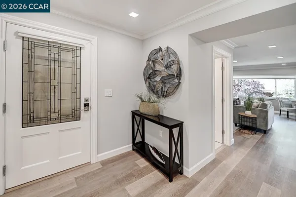 a view of front door with wooden floor