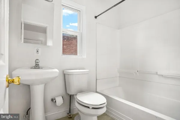 a bathroom with a sink and toilet