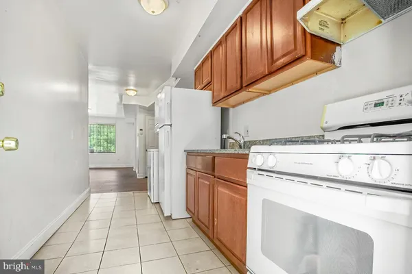 a kitchen with cabinets and stainless steel appliances