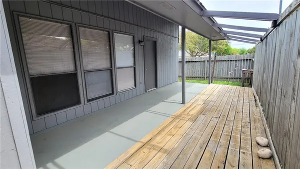 a view of balcony with wooden floor