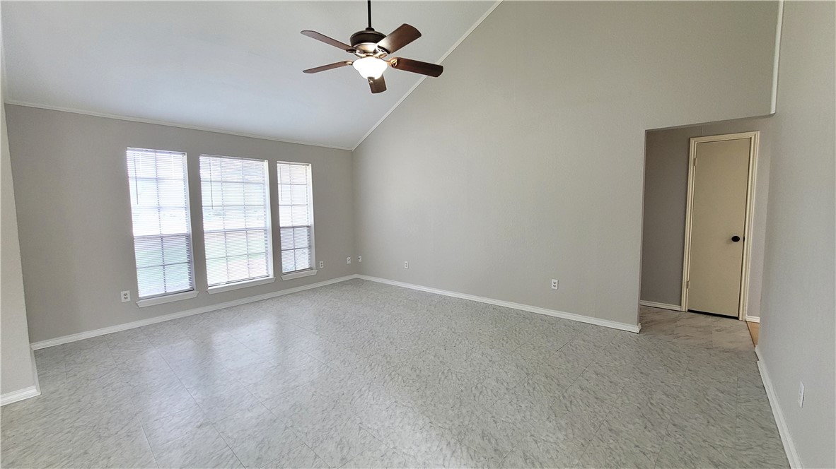 6925 Fawn Ridge Drive Corpus Christi, TX 78413 - Photo 3 of 16 wooden floor in an empty room with a window