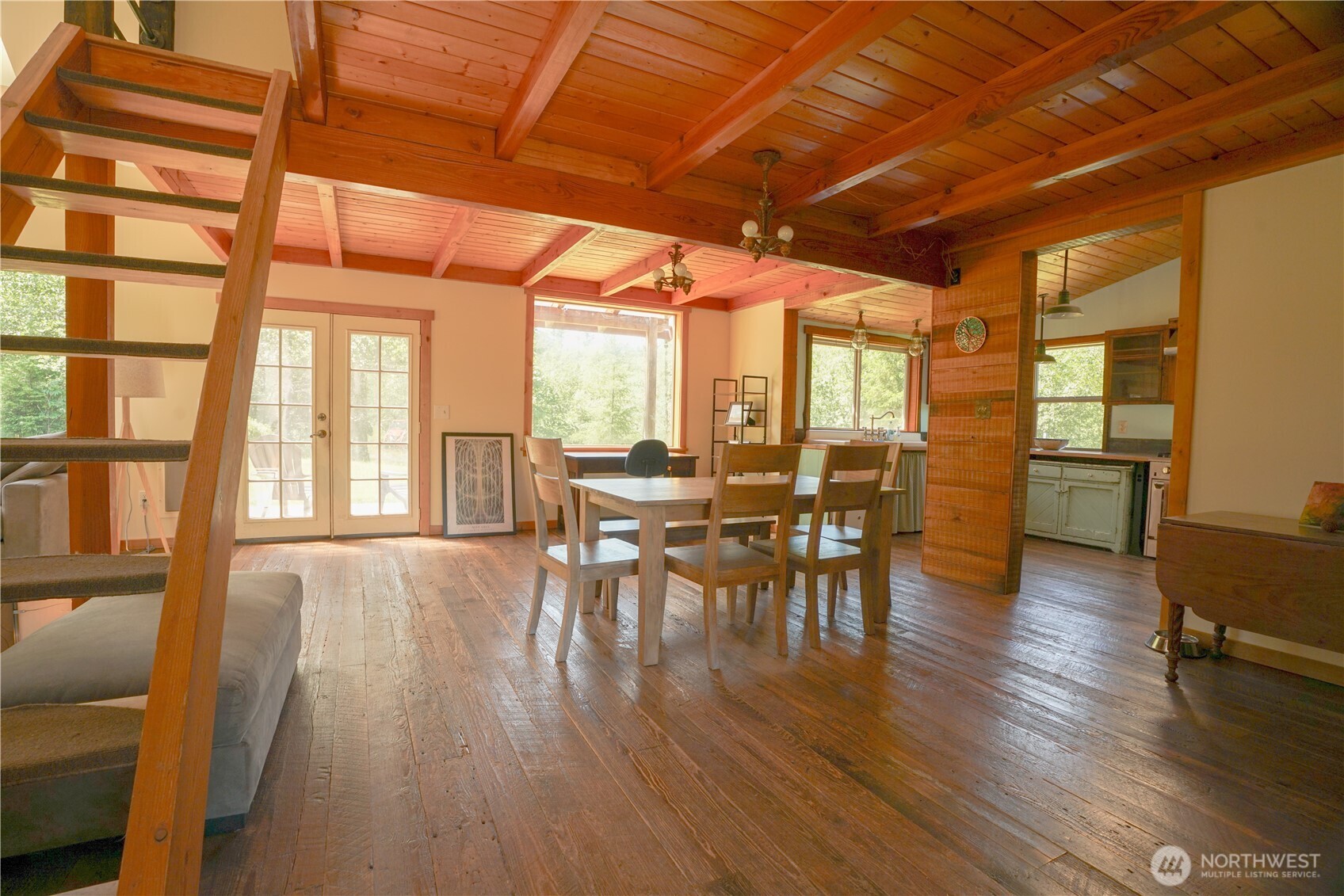 2904 Wildwood Road Quilcene, WA 98376 - Photo 9 of 39 a view of a dining room with furniture and wooden floor
