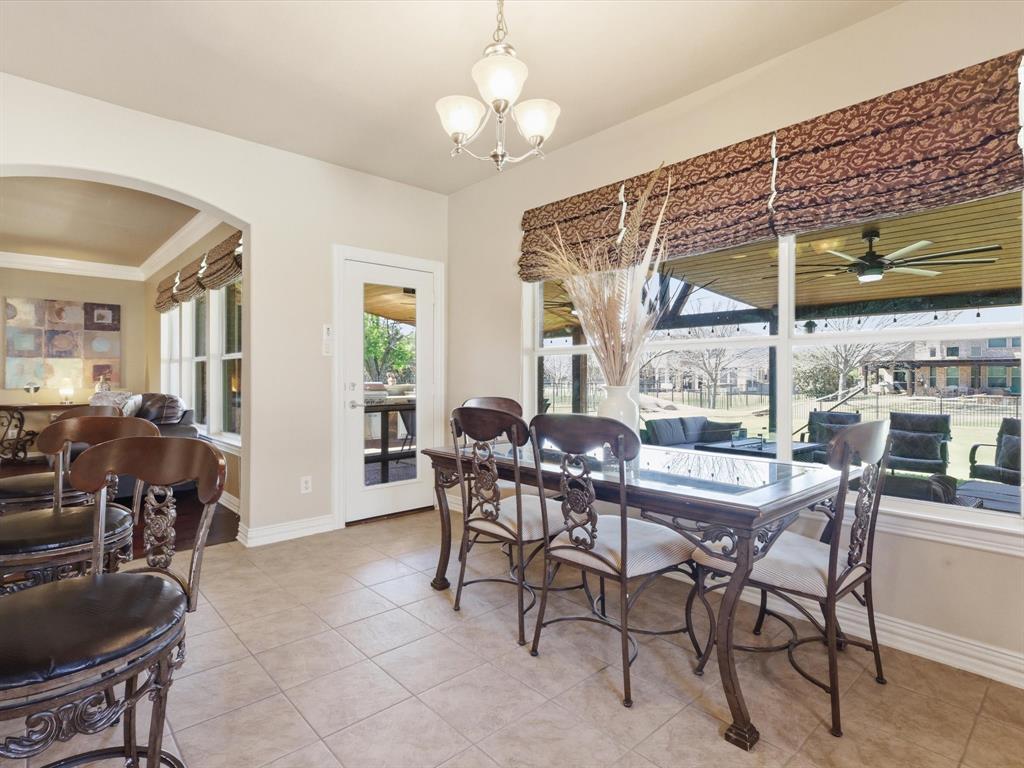 1130 Rio Bravo Way Shady Shores, TX 76208 - Photo 13 of 40 a dining room with furniture a chandelier and window