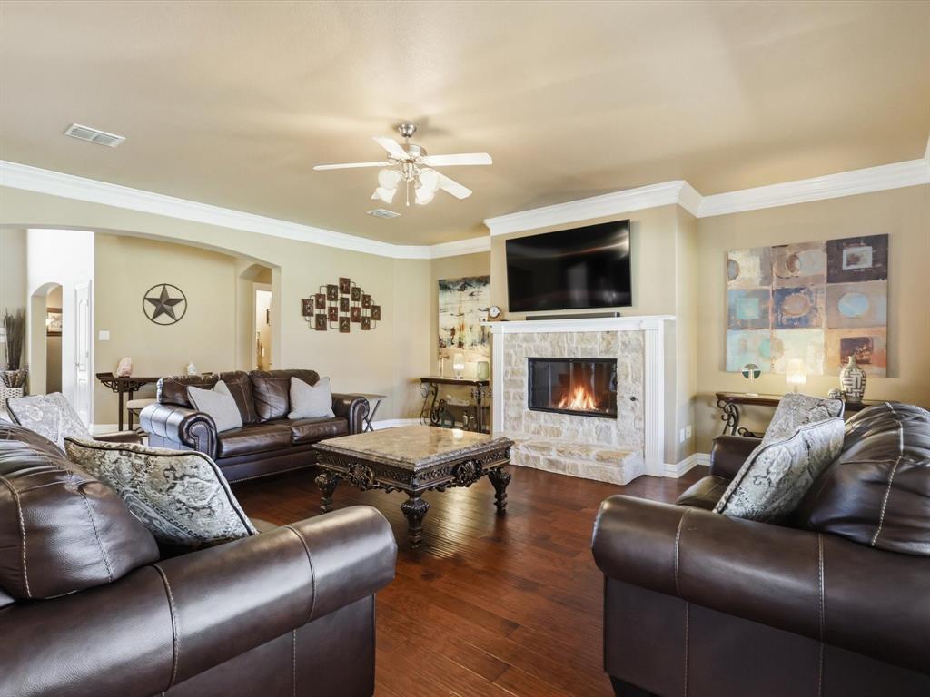 1130 Rio Bravo Way Shady Shores, TX 76208 - Photo 16 of 40 a living room with furniture a flat screen tv and a fireplace