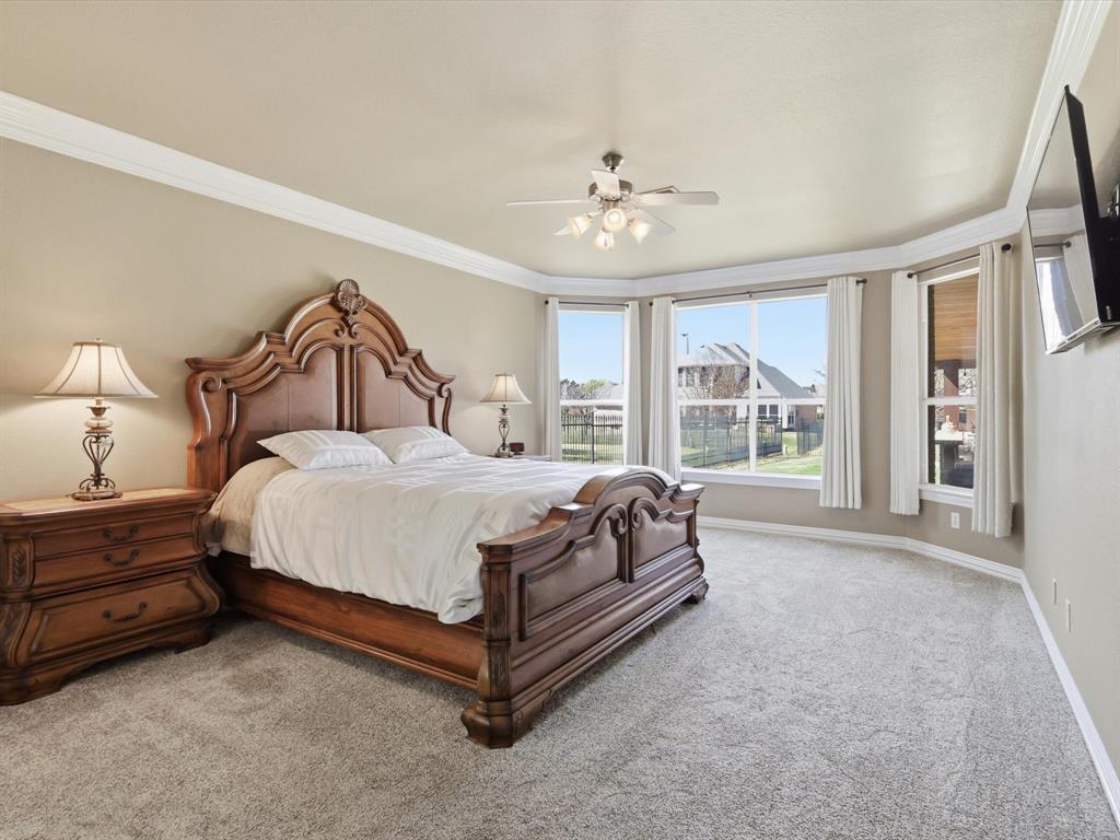 1130 Rio Bravo Way Shady Shores, TX 76208 - Photo 18 of 40 a spacious bedroom with a bed and a large window