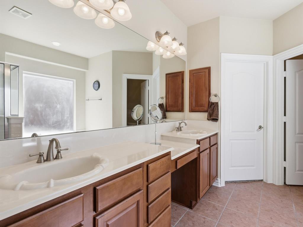 1130 Rio Bravo Way Shady Shores, TX 76208 - Photo 19 of 40 a bathroom with a sink double vanity and a mirror