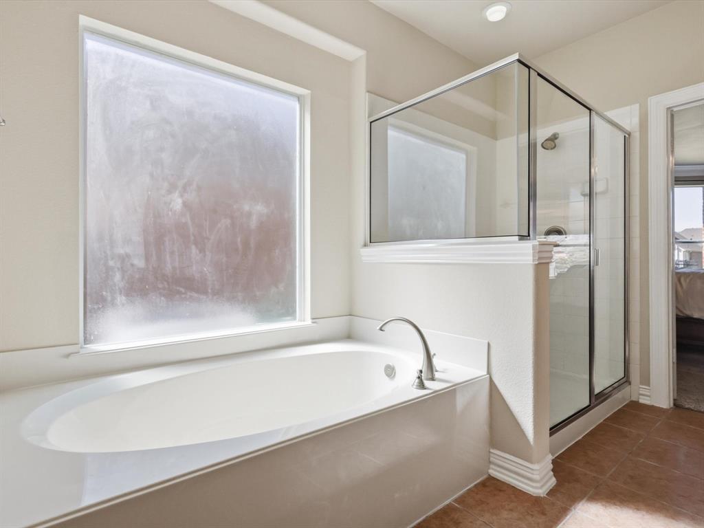 1130 Rio Bravo Way Shady Shores, TX 76208 - Photo 20 of 40 a bathroom with a bathtub and a shower