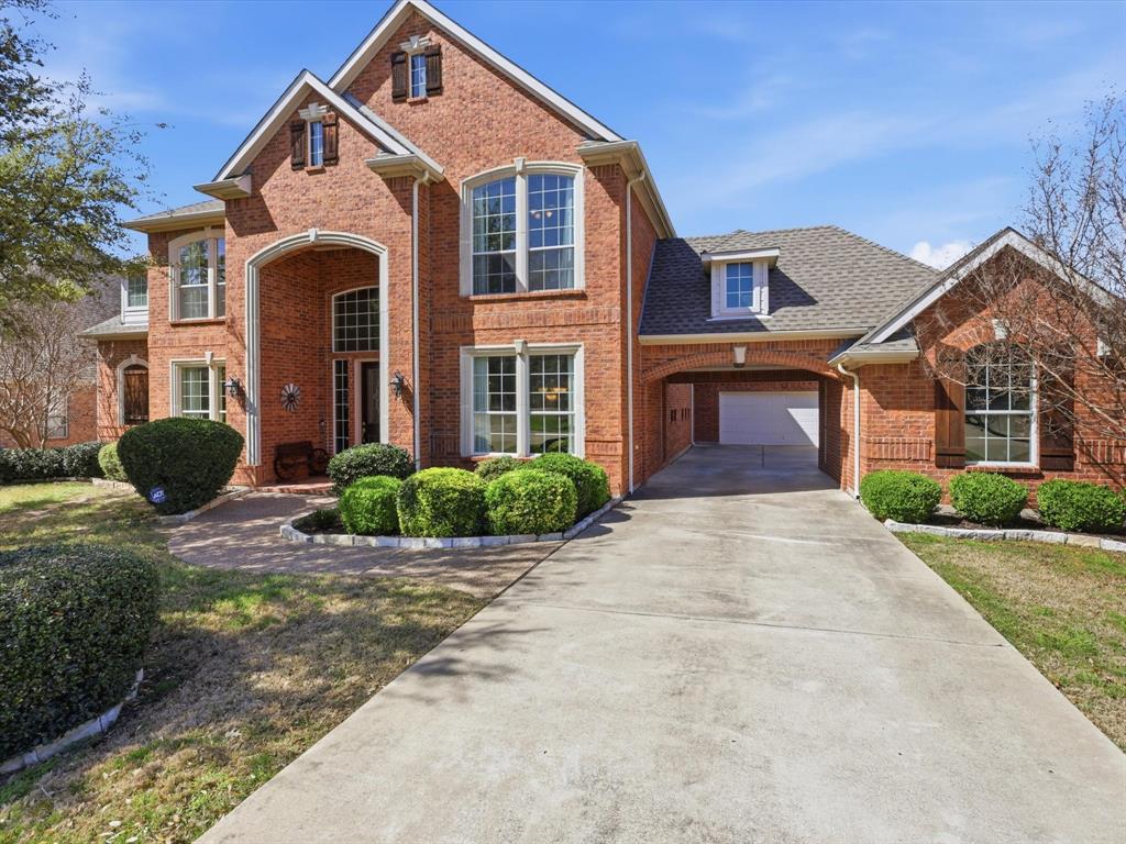 1130 Rio Bravo Way Shady Shores, TX 76208 - Photo 2 of 40 a front view of a house with yard and parking