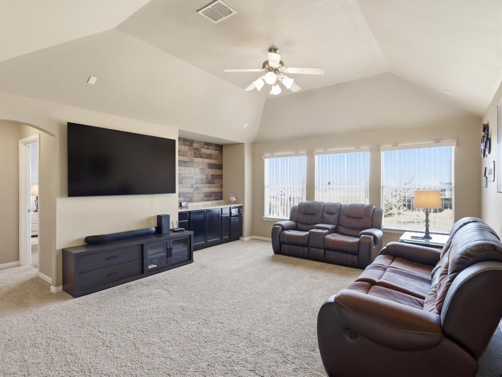 1130 Rio Bravo Way Shady Shores, TX 76208 - Photo 21 of 40 a living room with furniture and a flat screen tv
