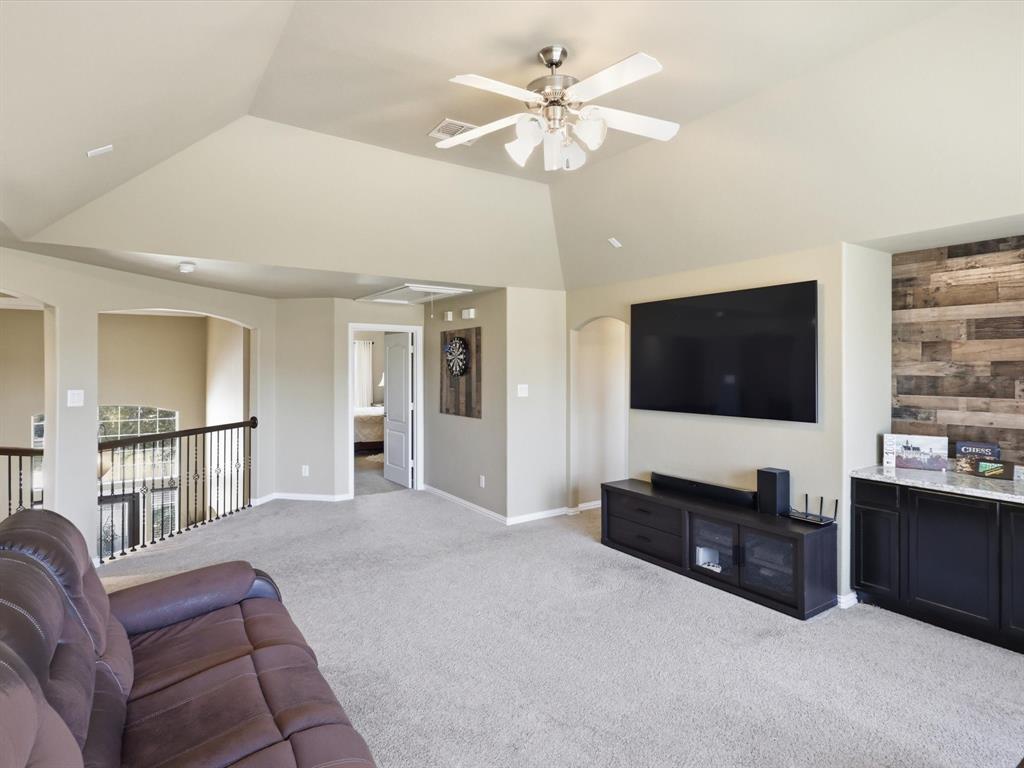 1130 Rio Bravo Way Shady Shores, TX 76208 - Photo 22 of 40 a living room with furniture and a flat screen tv