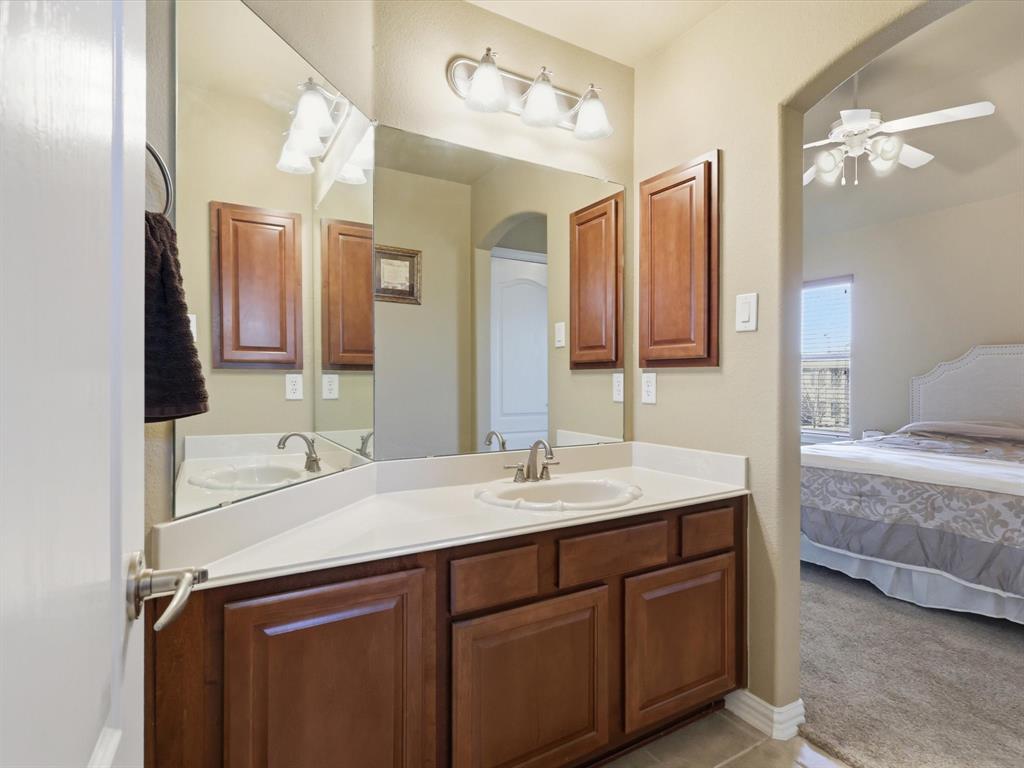 1130 Rio Bravo Way Shady Shores, TX 76208 - Photo 28 of 40 a bathroom with a sink double vanity and a mirror