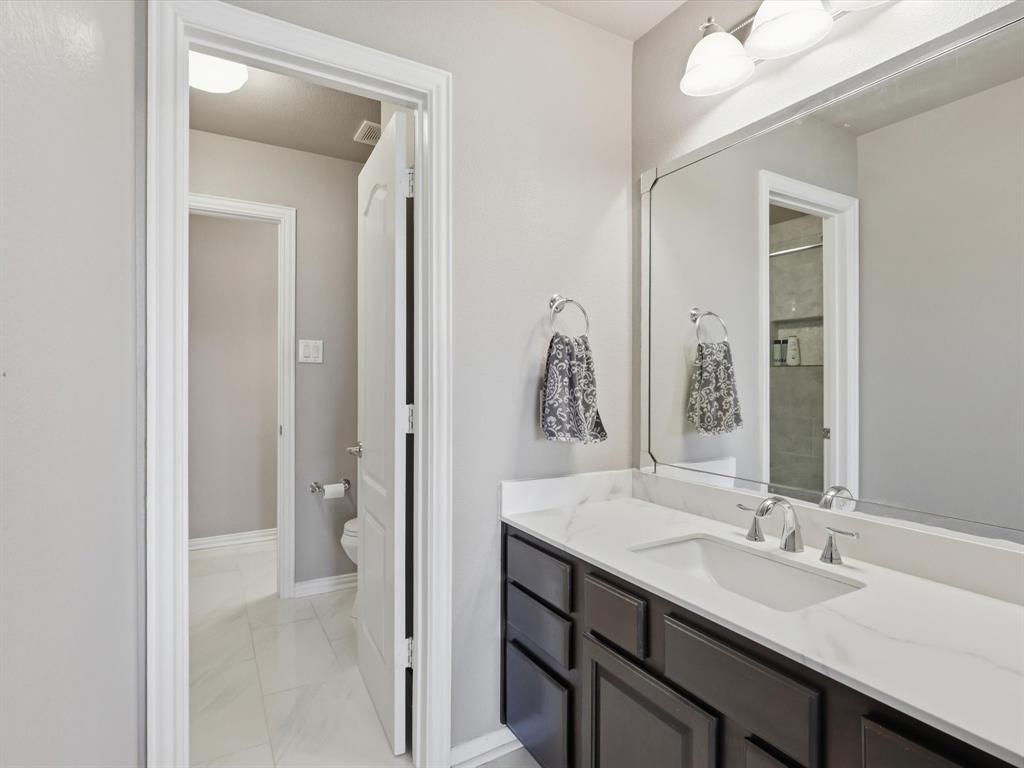1130 Rio Bravo Way Shady Shores, TX 76208 - Photo 31 of 40 a bathroom with a double vanity sink mirror and double
