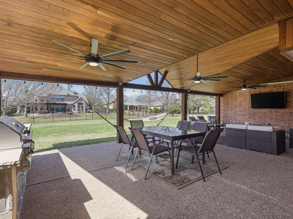1130 Rio Bravo Way Shady Shores, TX 76208 - Photo 32 of 40 a view of a patio with table and chairs under an umbrella