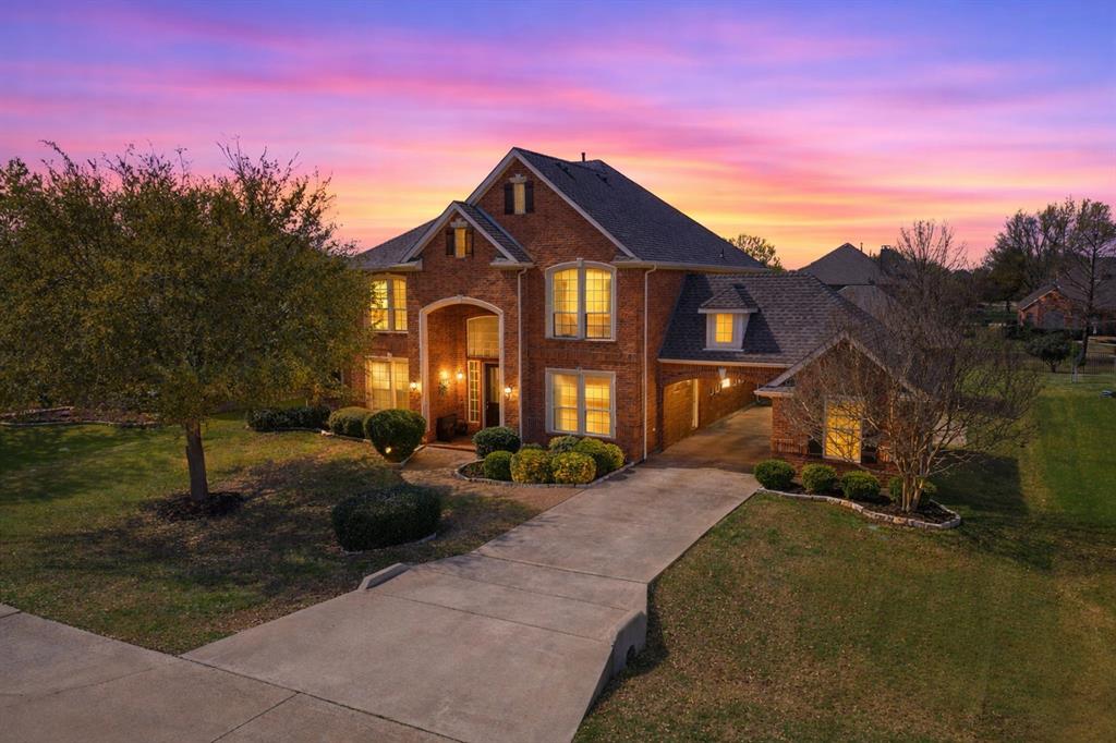 1130 Rio Bravo Way Shady Shores, TX 76208 - Photo 4 of 40 a front view of a house with a yard
