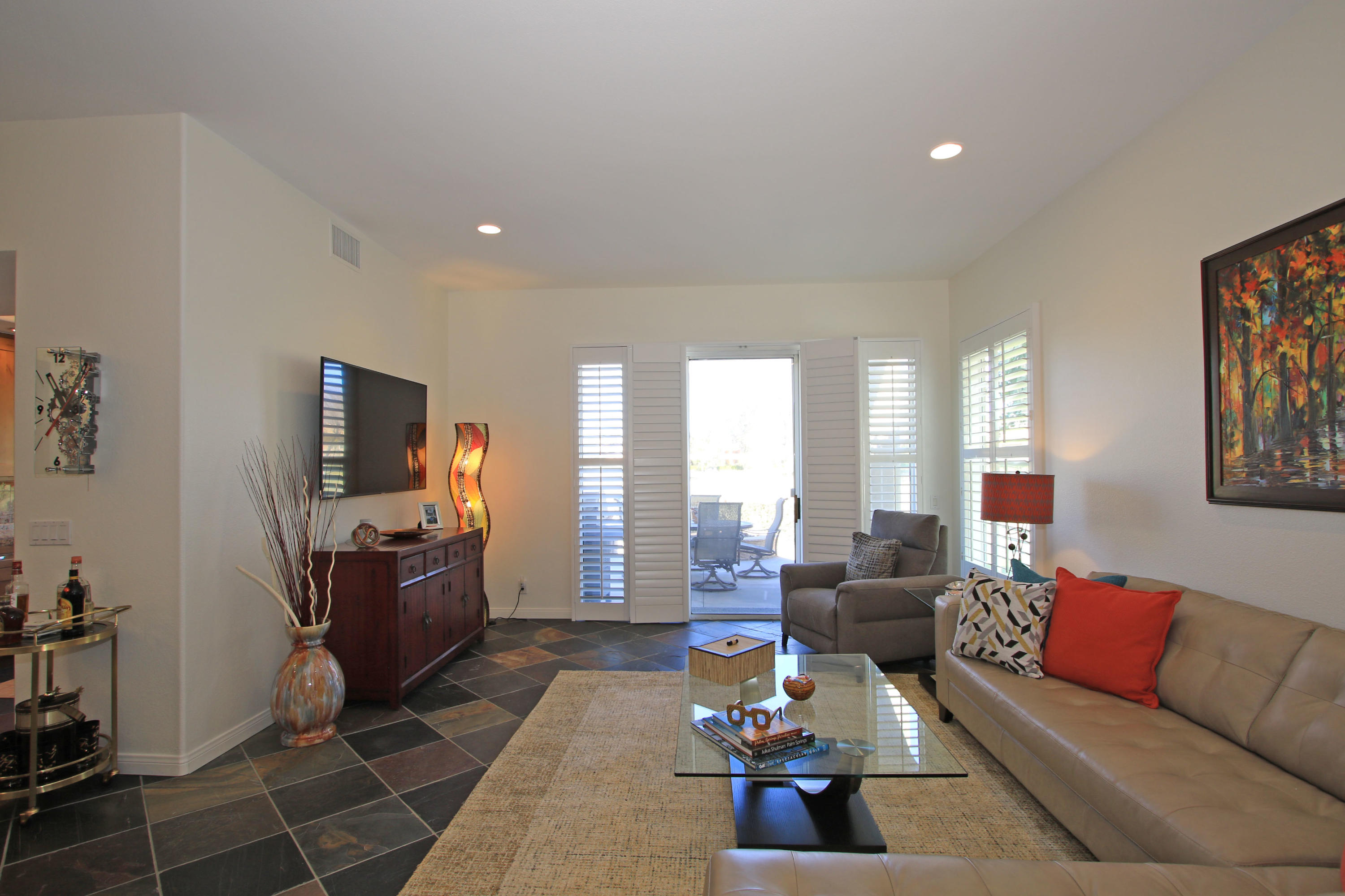 36 Pine Valley Drive Rancho Mirage, CA 92270 - Photo 11 of 57 a living room with furniture and a flat screen tv