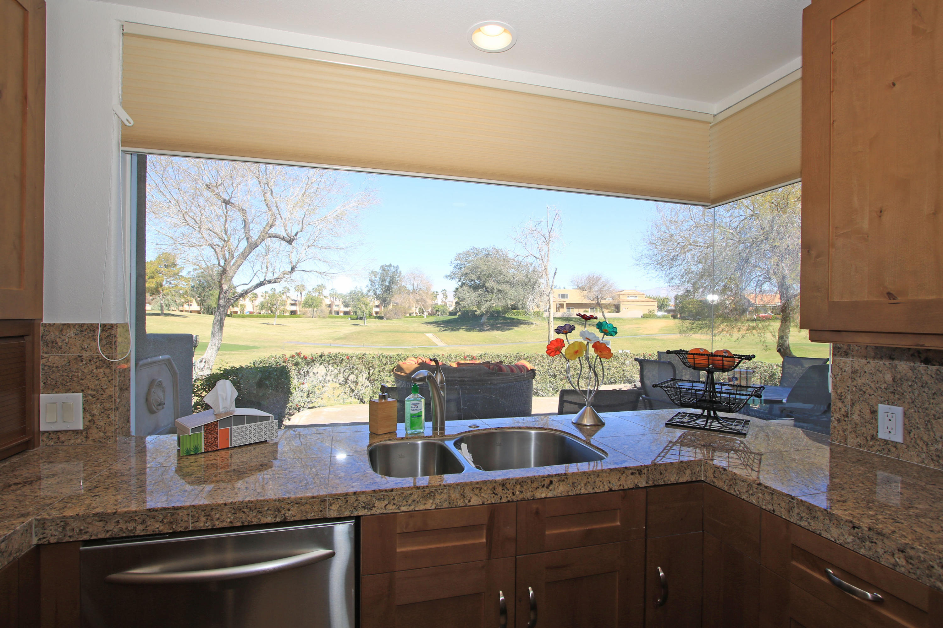 36 Pine Valley Drive Rancho Mirage, CA 92270 - Photo 15 of 57 a kitchen with granite countertop a sink and a stove