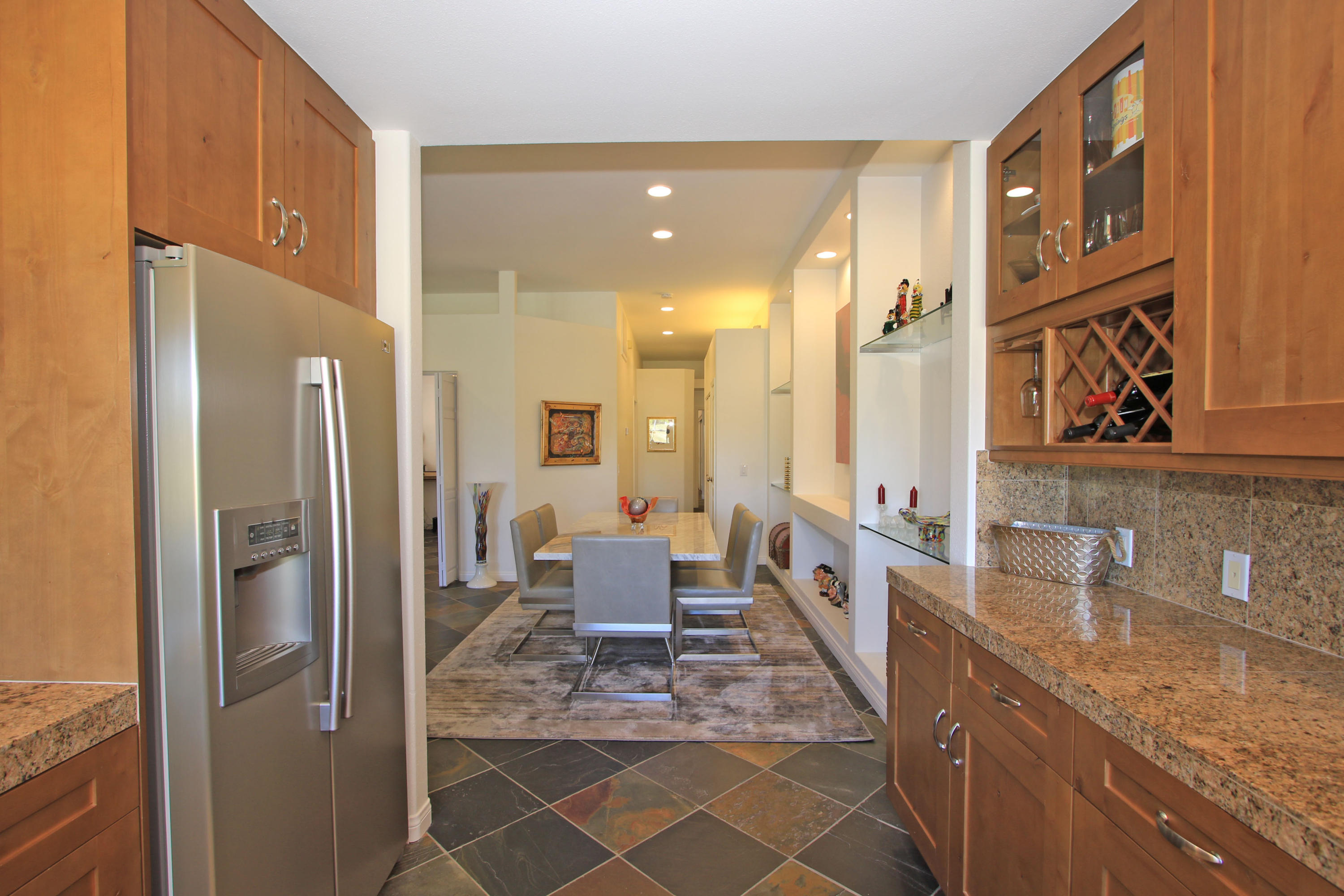 36 Pine Valley Drive Rancho Mirage, CA 92270 - Photo 16 of 57 a large bathroom with a granite countertop sink a large mirror and a shower