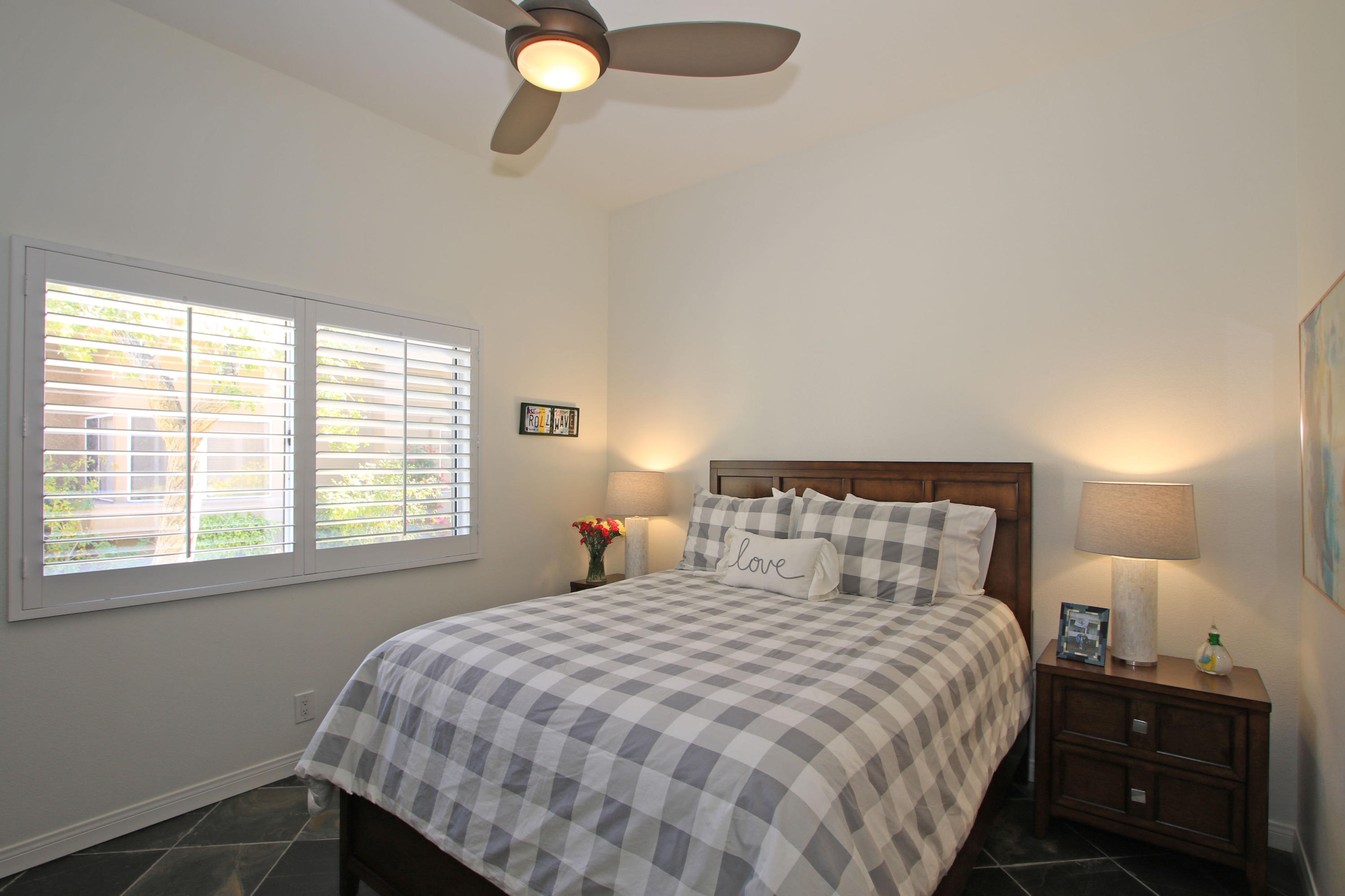 36 Pine Valley Drive Rancho Mirage, CA 92270 - Photo 27 of 57 a bedroom with a bed and window