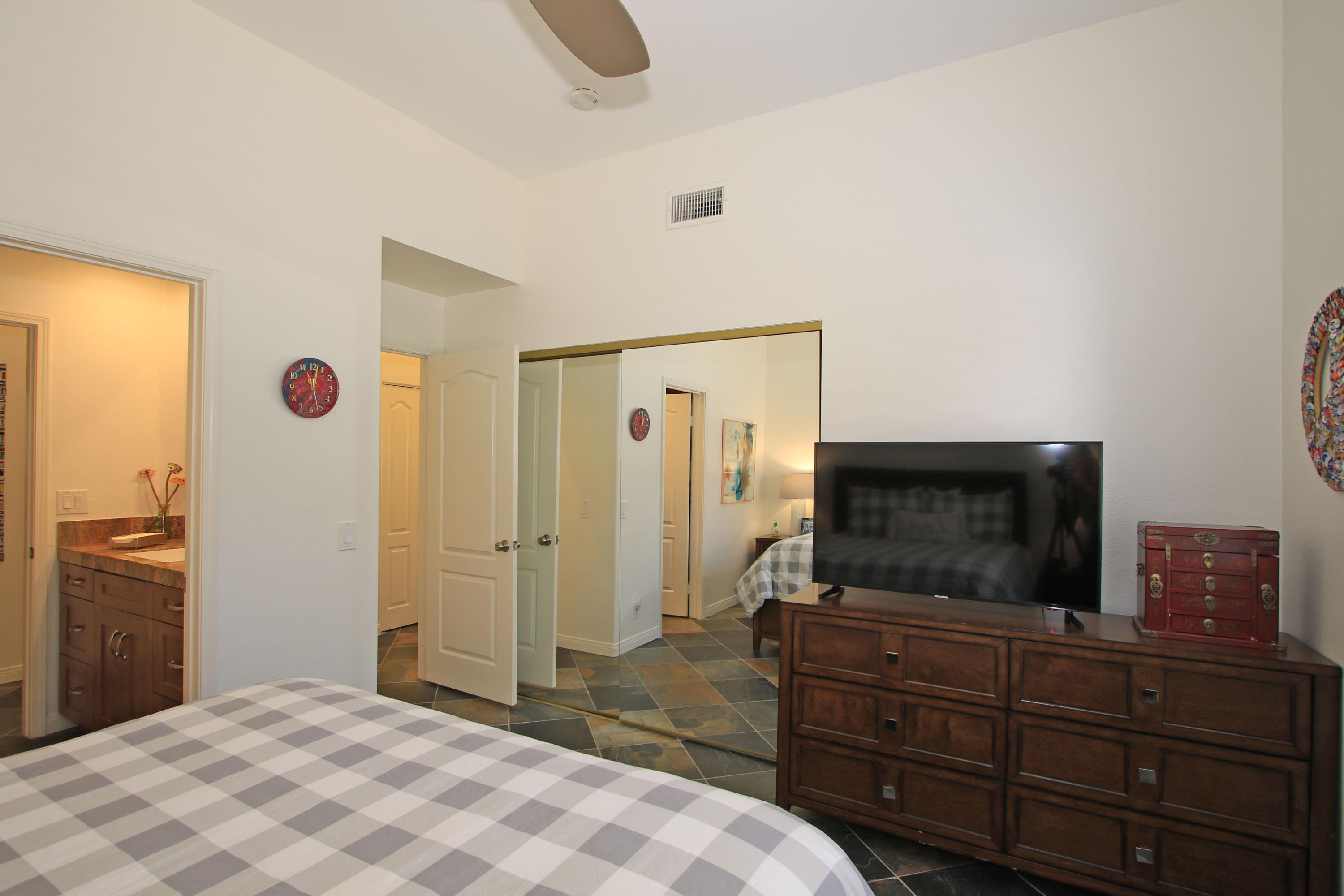 36 Pine Valley Drive Rancho Mirage, CA 92270 - Photo 28 of 57 a bedroom with a bed and a flat screen tv