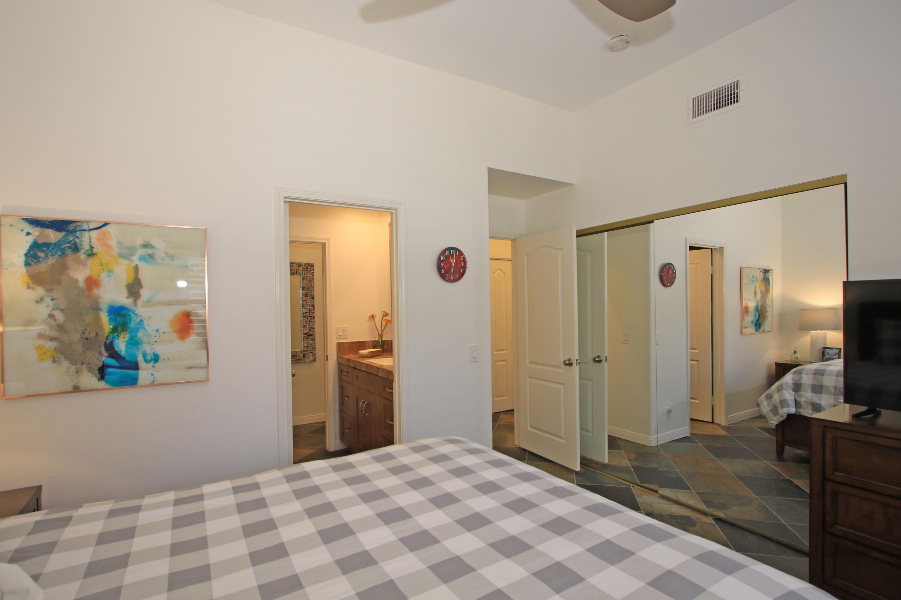 36 Pine Valley Drive Rancho Mirage, CA 92270 - Photo 29 of 57 a bedroom with a bed and a flat screen tv