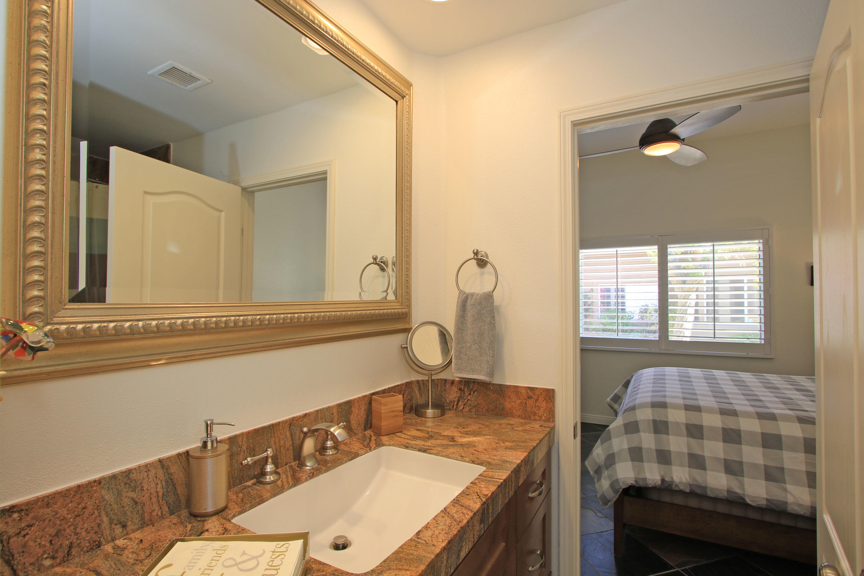 36 Pine Valley Drive Rancho Mirage, CA 92270 - Photo 30 of 57 a bathroom with a sink and a mirror