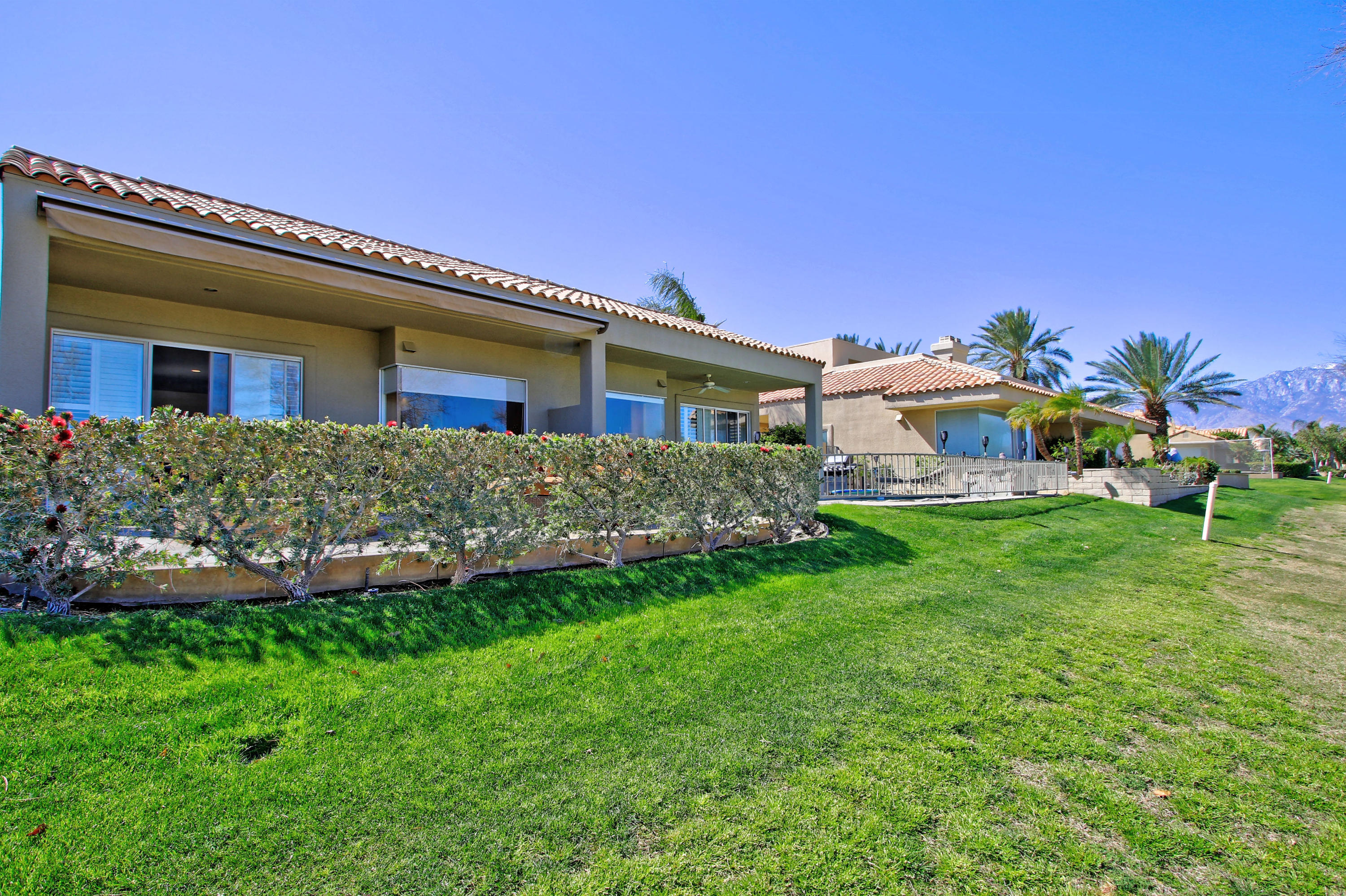 36 Pine Valley Drive Rancho Mirage, CA 92270 - Photo 32 of 57 a front view of house with yard and outdoor seating