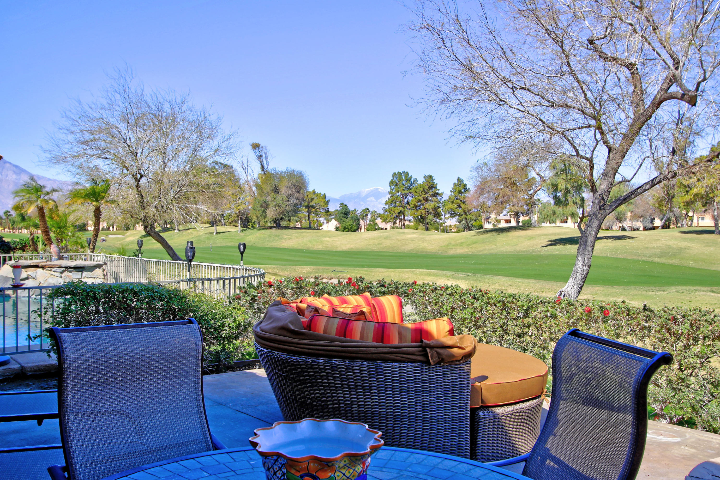 36 Pine Valley Drive Rancho Mirage, CA 92270 - Photo 38 of 57 a view of a chairs and table in the patio