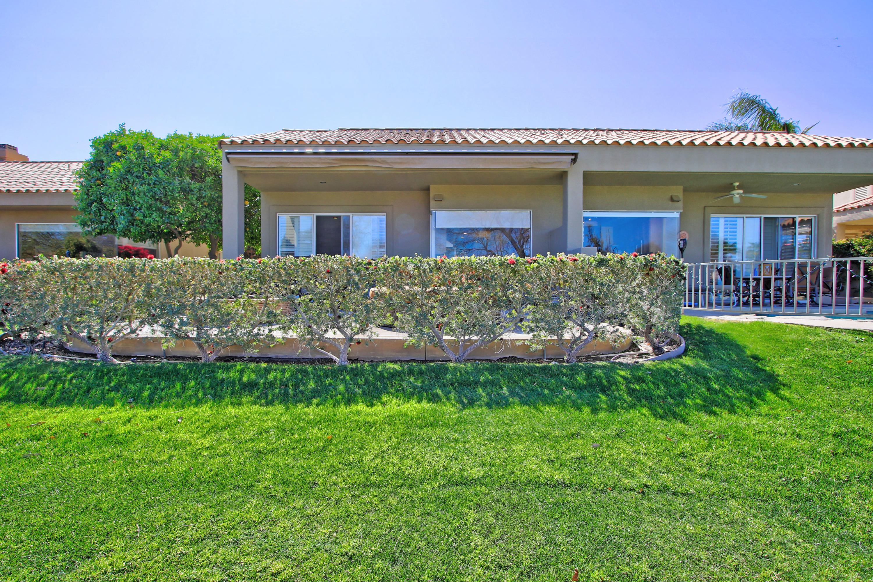 36 Pine Valley Drive Rancho Mirage, CA 92270 - Photo 40 of 57 a front view of a house with a garden