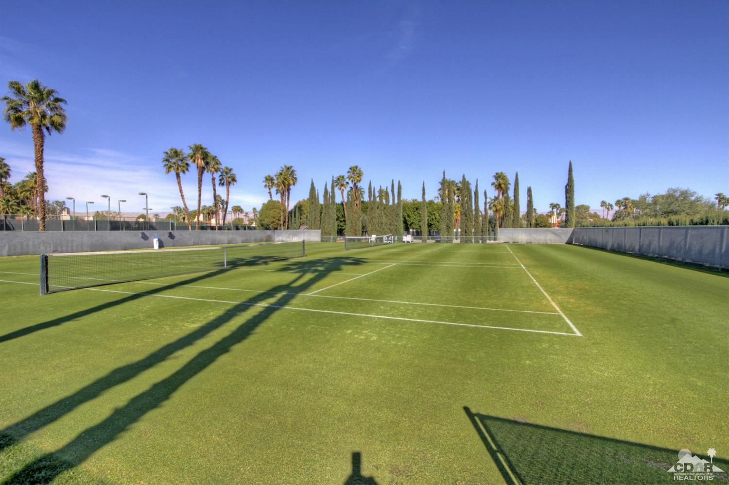36 Pine Valley Drive Rancho Mirage, CA 92270 - Photo 54 of 57 a tennis court with trees in the background