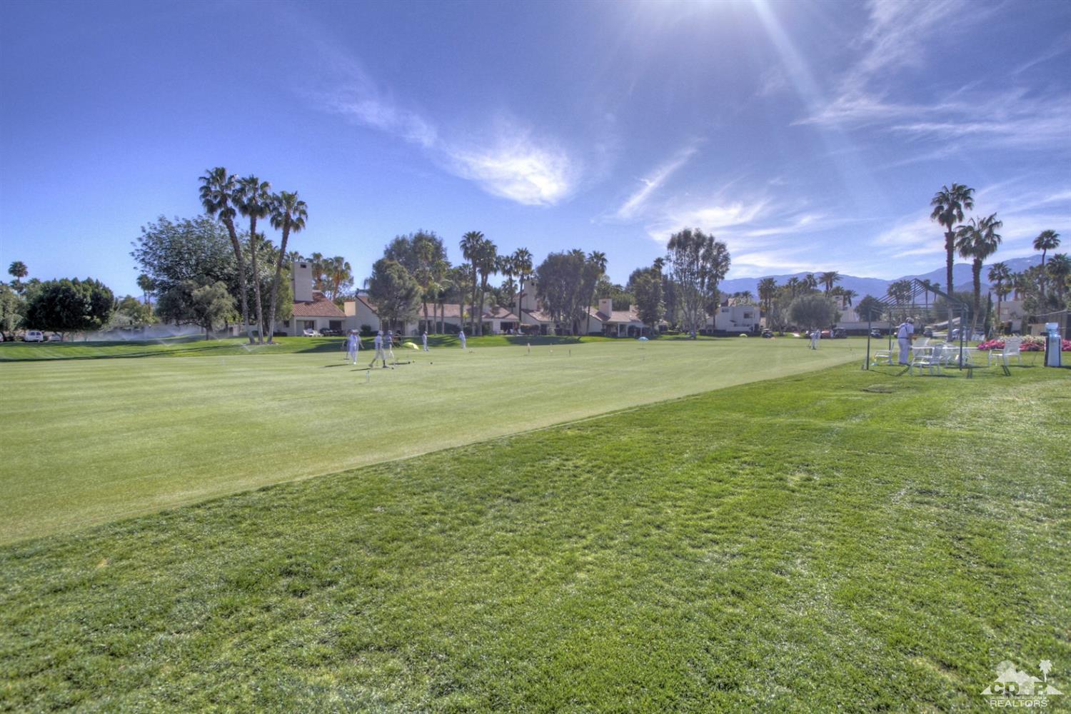 36 Pine Valley Drive Rancho Mirage, CA 92270 - Photo 55 of 57 a view of a big yard with a house in the background