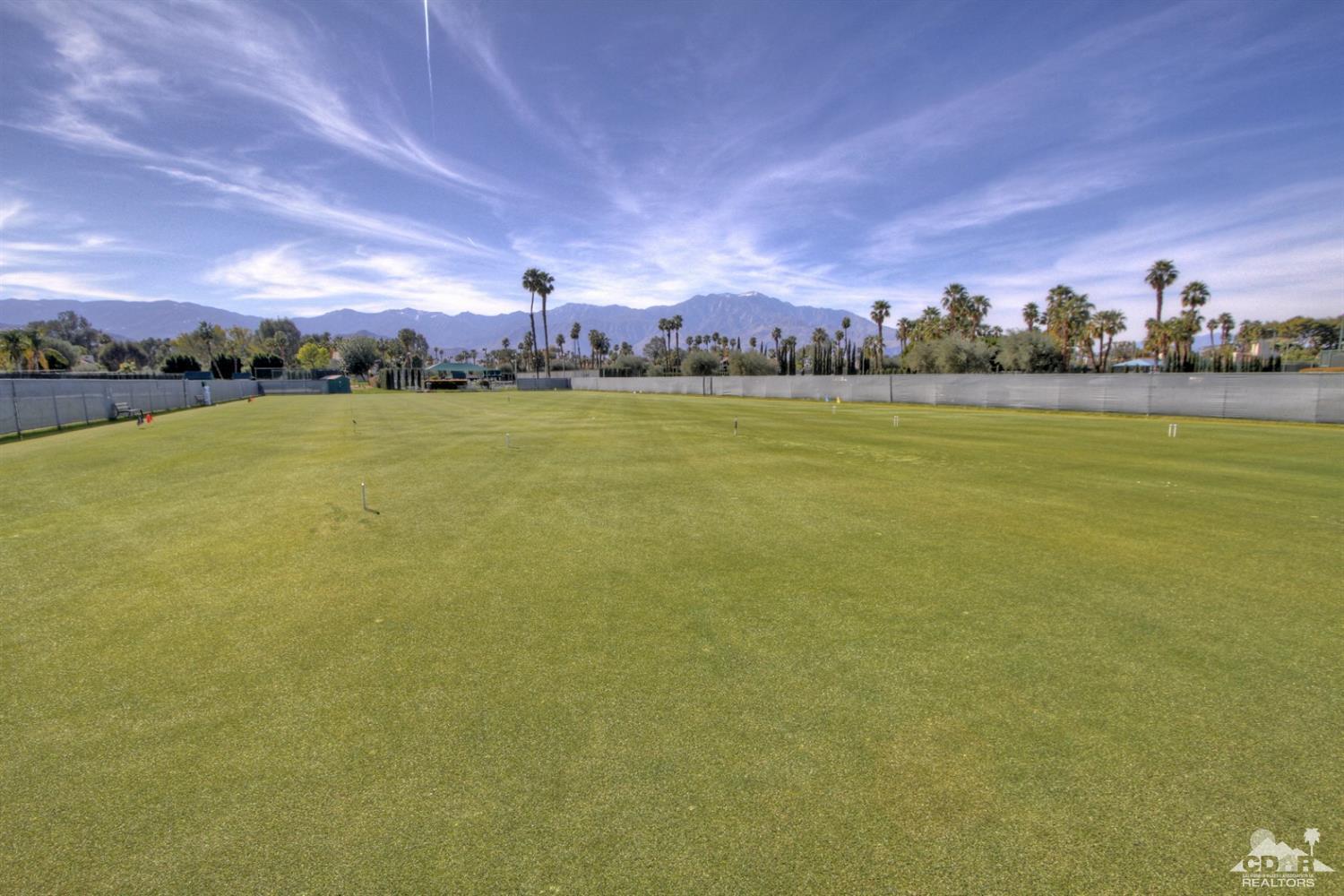 36 Pine Valley Drive Rancho Mirage, CA 92270 - Photo 57 of 57 a view of a lake with houses in the background