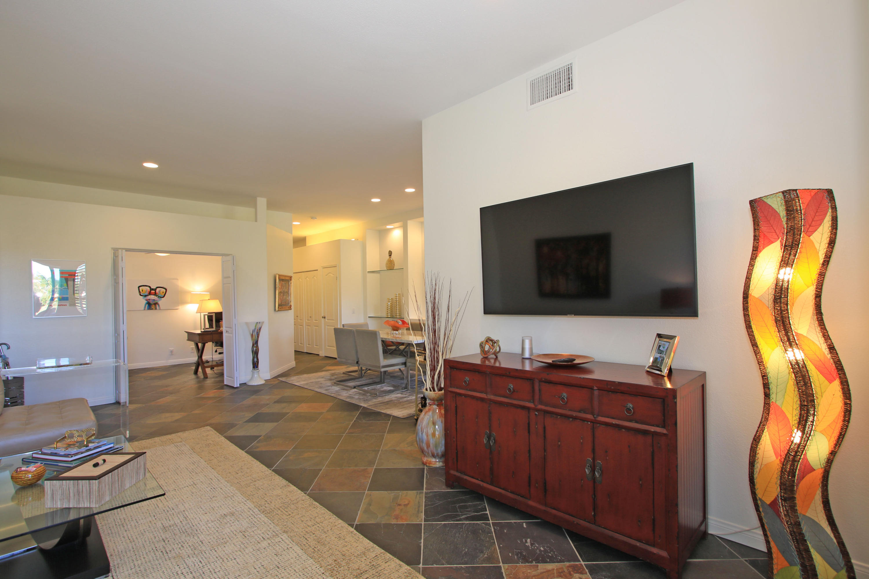 36 Pine Valley Drive Rancho Mirage, CA 92270 - Photo 8 of 57 a view of a livingroom with workspace and a flat screen tv