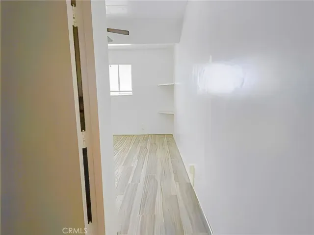 a view of a dining room with furniture and a potted plant