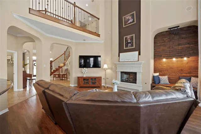 a living room with fireplace furniture and a flat screen tv