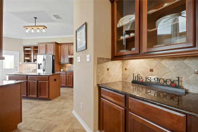 a kitchen with stainless steel appliances granite countertop a sink and cabinets