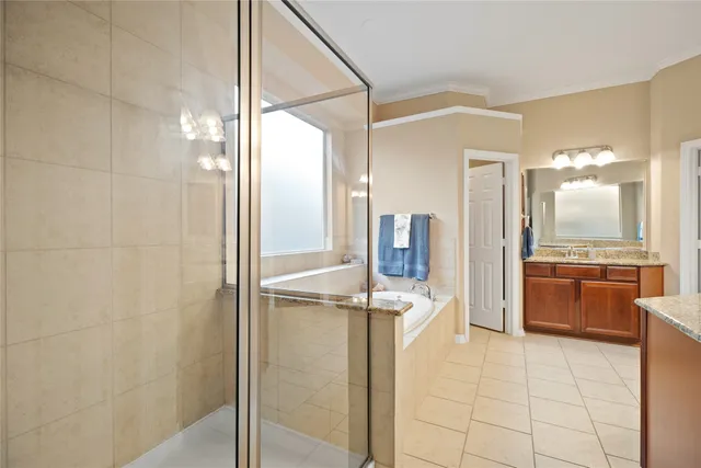 a bathroom with a shower and a sink