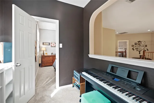 a bathroom with a sink a toilet and shower curtain