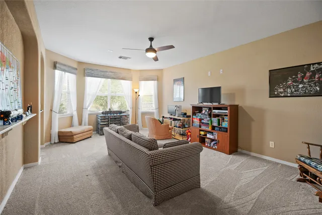 a backyard of a house with table and chairs