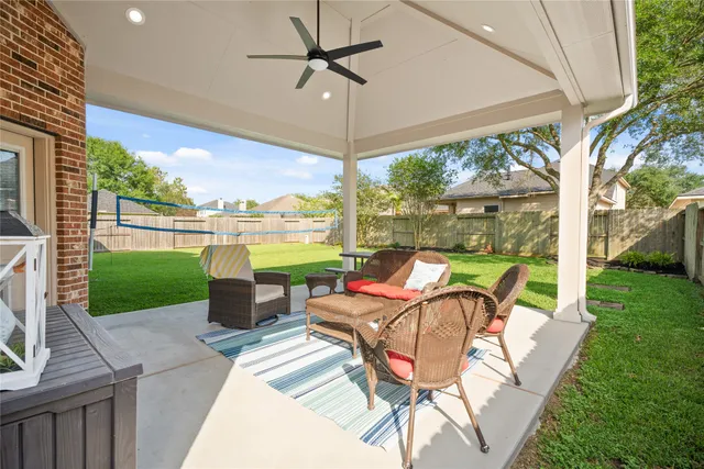 a view of a patio with a table and chairs