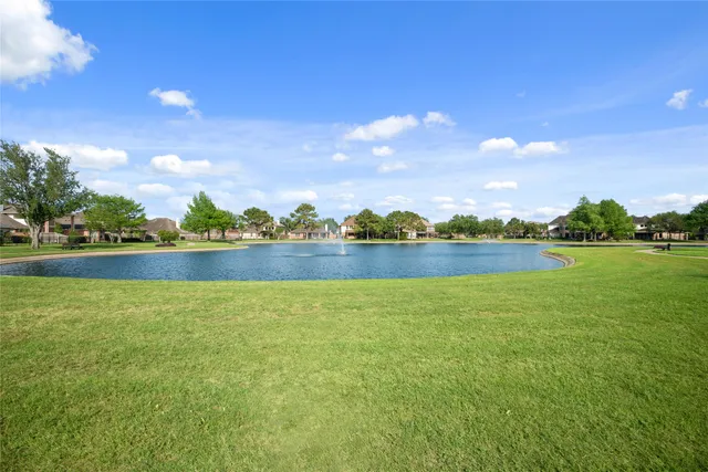 a view of swimming pool with an outdoor seating