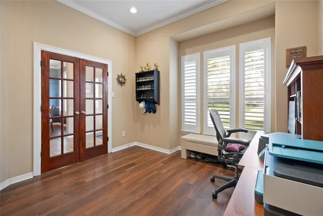 a view of a room with gym equipment and a large window