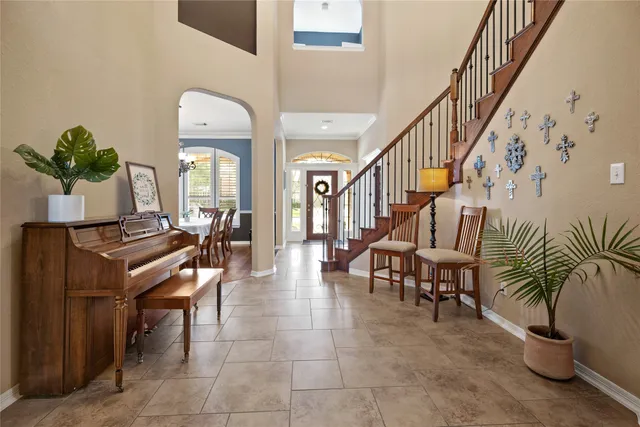 a lobby with furniture and a potted plant